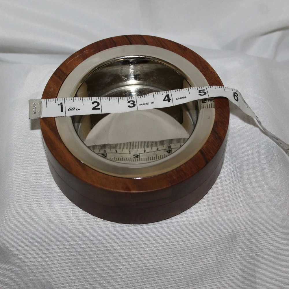 West Elm solid acacia wood bowl with metal alloy bowl in a Silver finish.